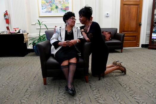 Albertine Sellers gets congratulated by her longtime friend LaTonya Lacy, right after be given a service pin to celebrate her 60+ years of service of working for the city in the Mayor's office on March 9, 2017 in Denver.